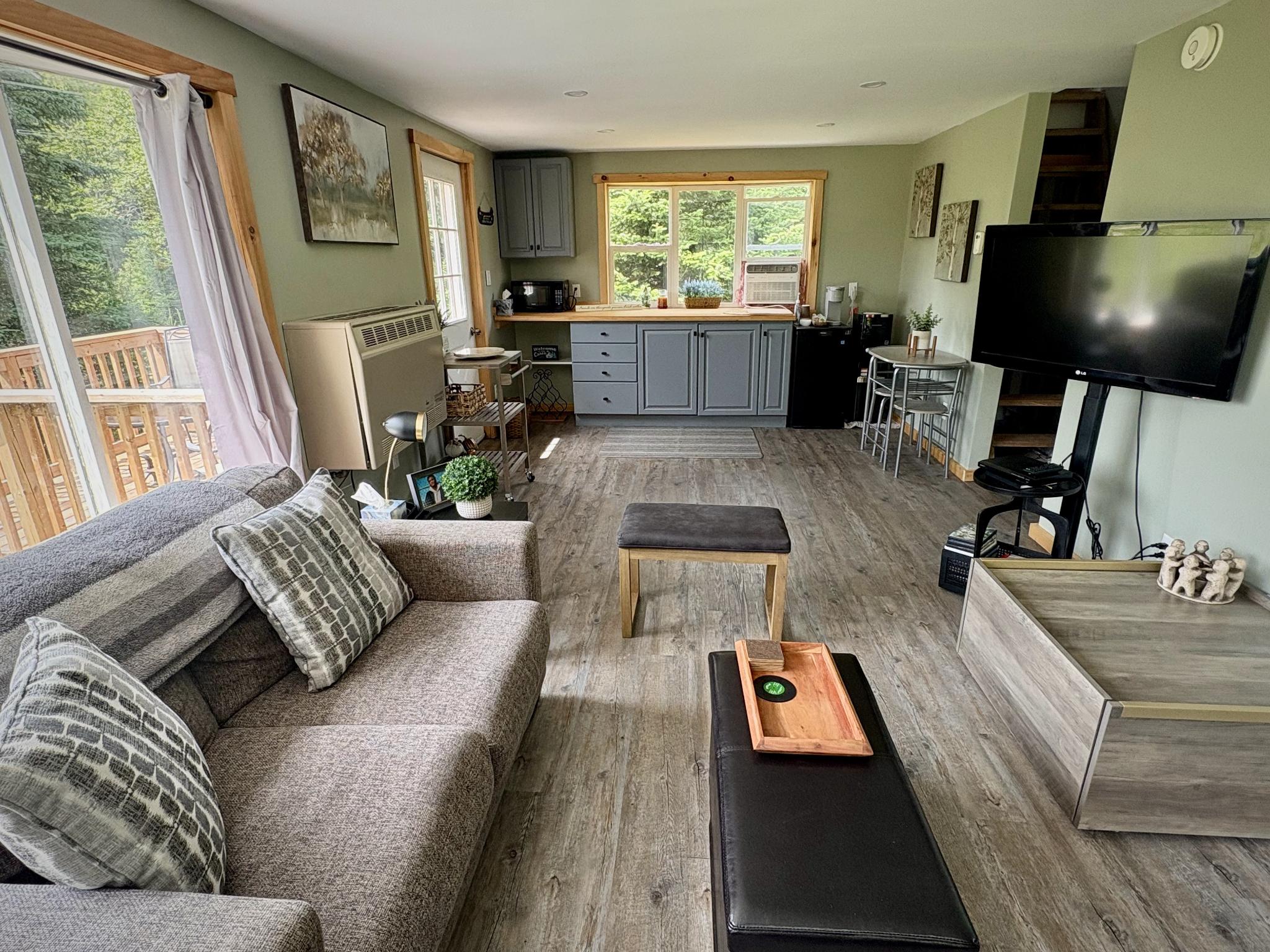 Wide view of the living and kitchen area